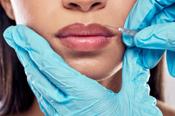 https://dhcmed.com/wp-content/uploads/2025/05/shot-of-a-woman-having-her-lips-injected-with-fill-2022-08-26-11-54-47-utc-scaled-1.webp